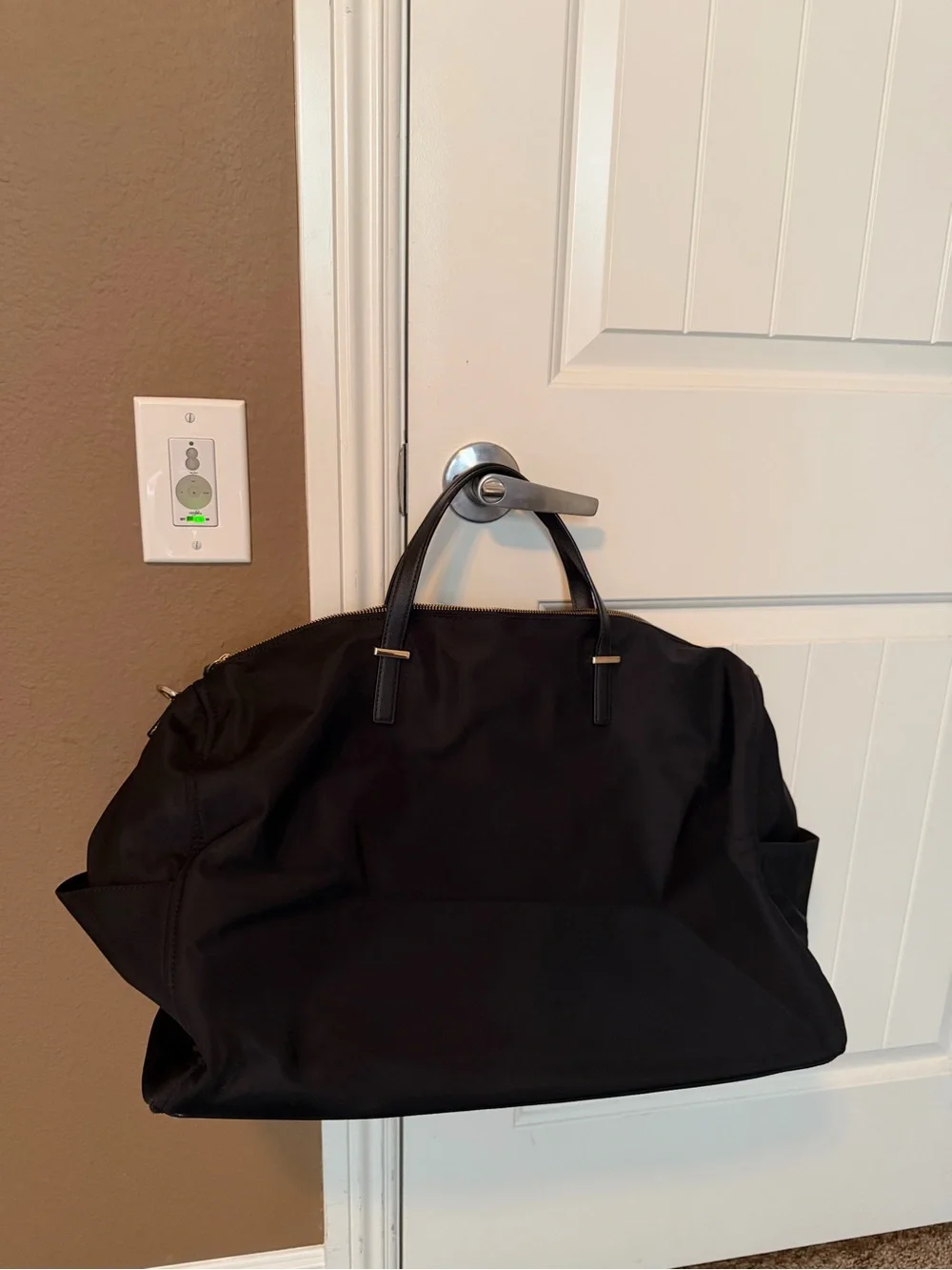 kate spade black nylon duffel with gold hardware